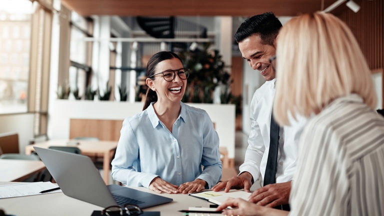 smiling-office-workers-chatting